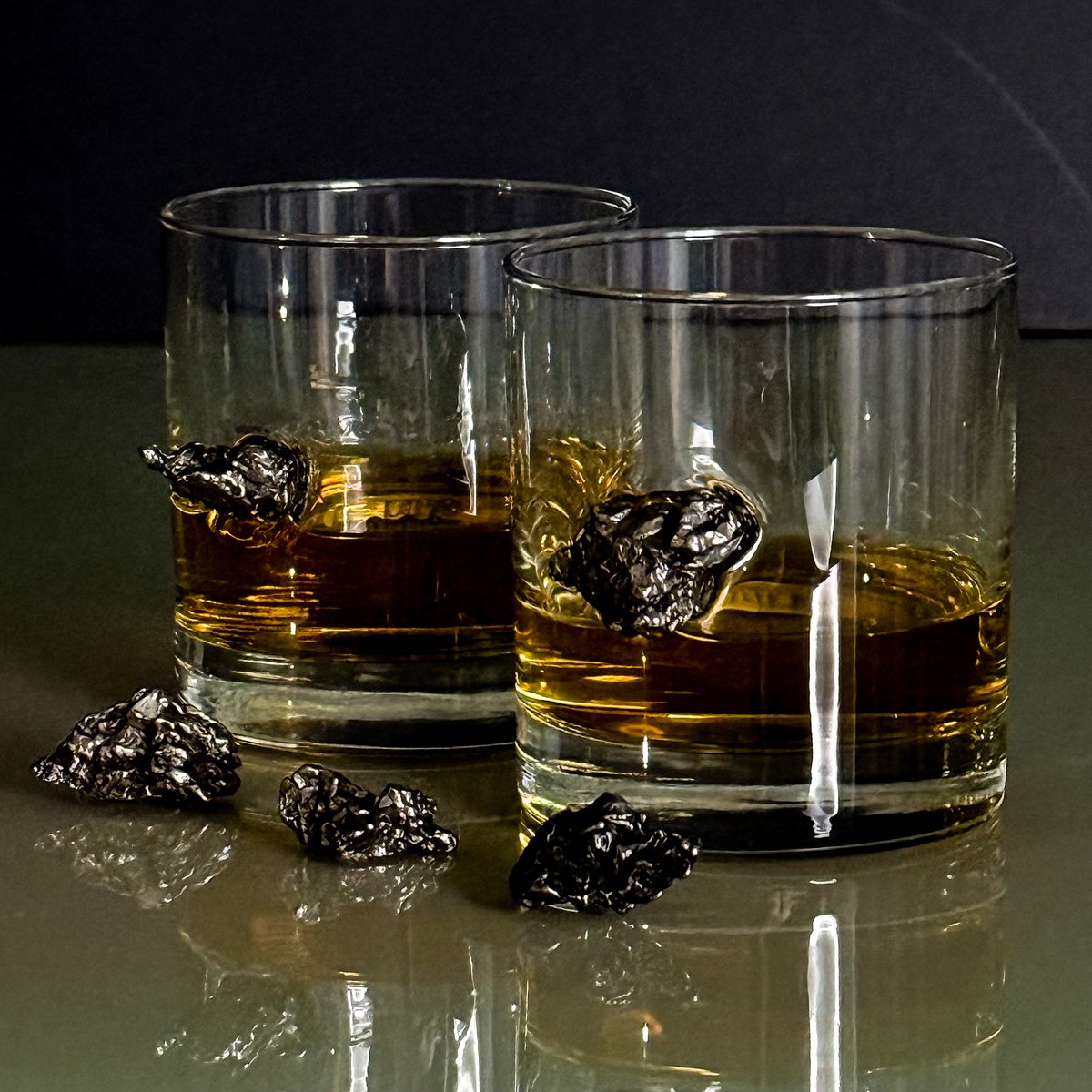 Two Solstice Foundry meteorite whiskey glasses